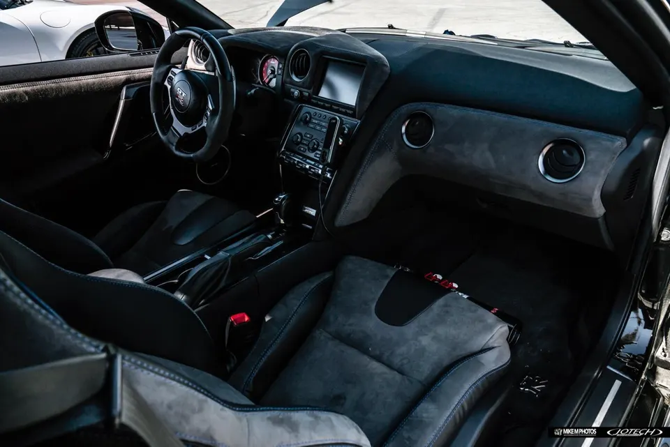 Nissan GT-R interior with alcantara seats, custom dashboard, and steering wheel