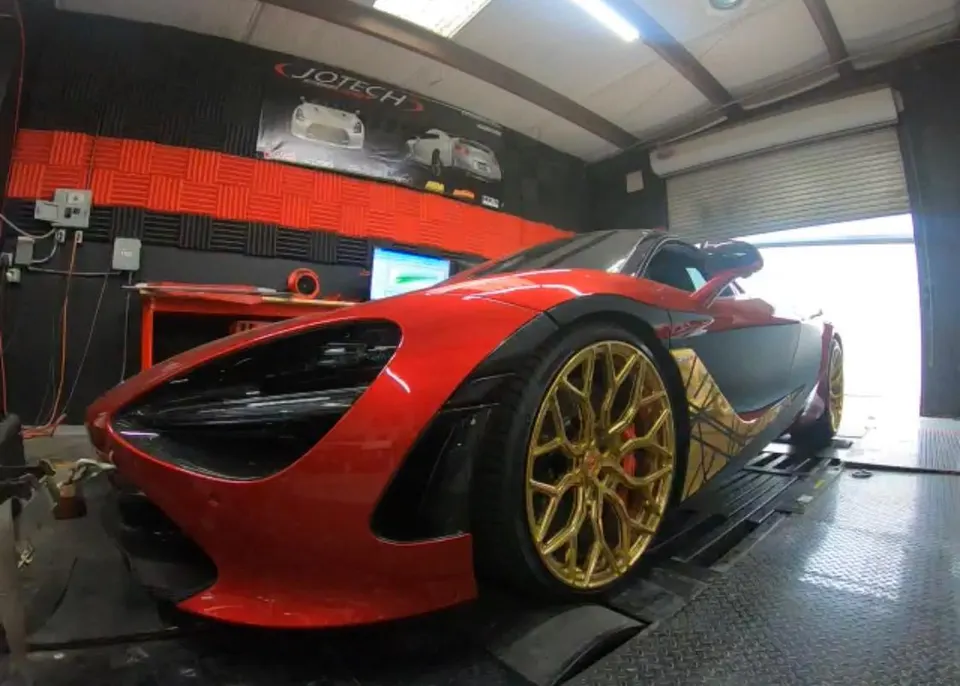 Red and gold McLaren supercar on a Jotech Motorsports dyno, undergoing performance testing and tuning.