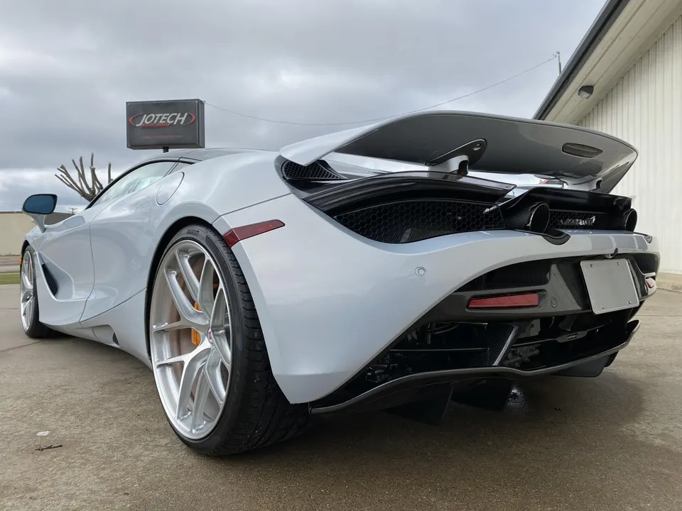 Silver McLaren 720S with aftermarket HRE wheels parked outside Jotech Motorsports.