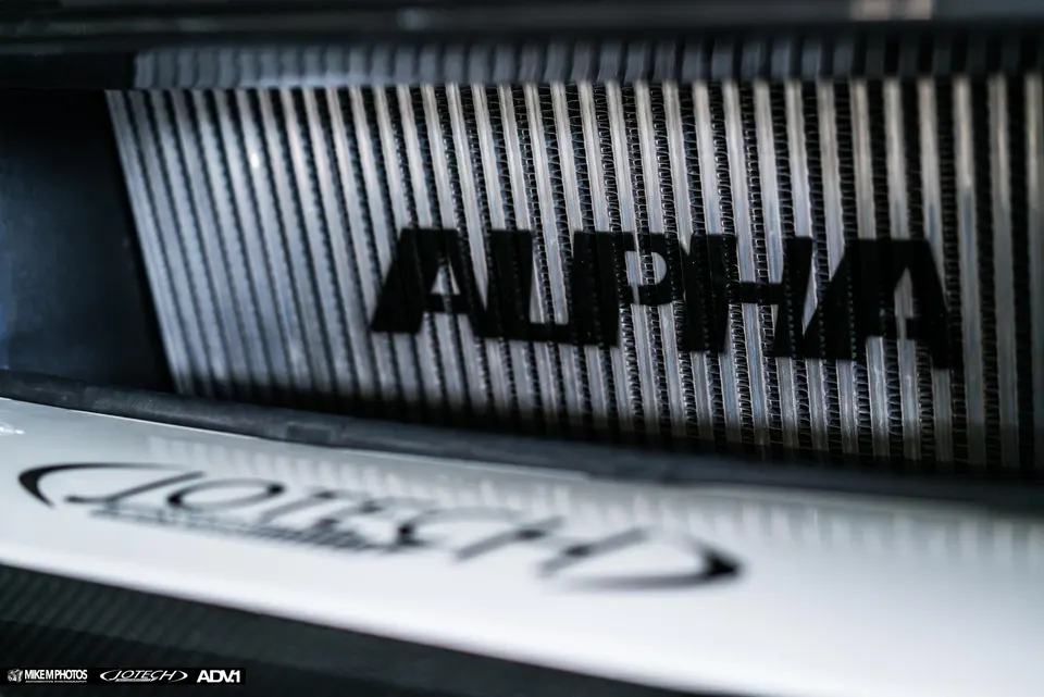 Close-up of an Alpha Performance intercooler, a key component for turbo boost systems.
