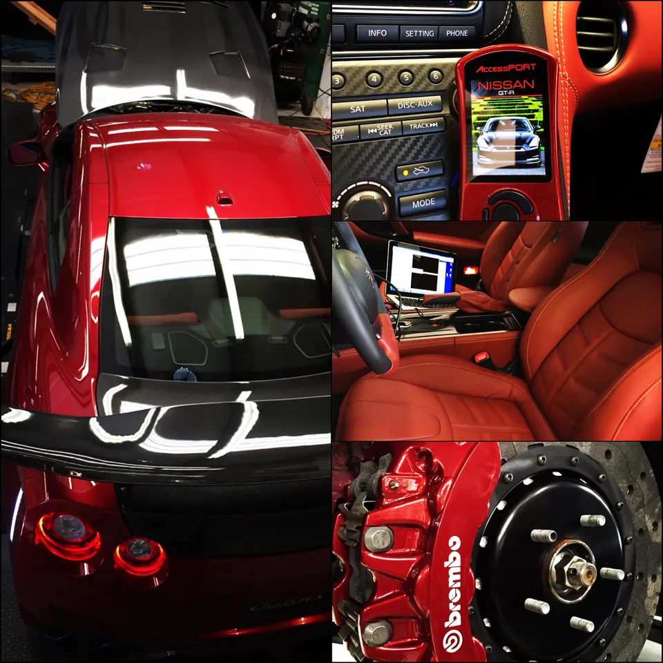 Red Nissan GT-R in a tuning shop, featuring a Cobb AccessPORT, laptop for tuning, and Brembo brakes.