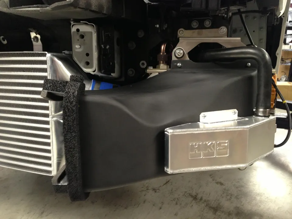 HKS intercooler and oil catch can installation in a performance car's front bumper area