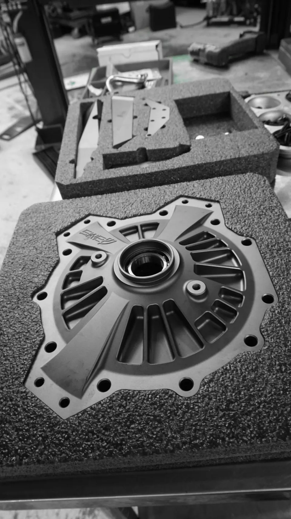 High-performance drivetrain component in custom foam packaging at Jotech Motorsports shop