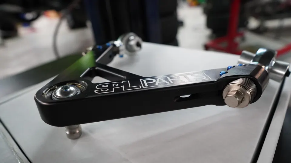 SPL Parts upper control arm, a performance suspension component for enhanced handling.