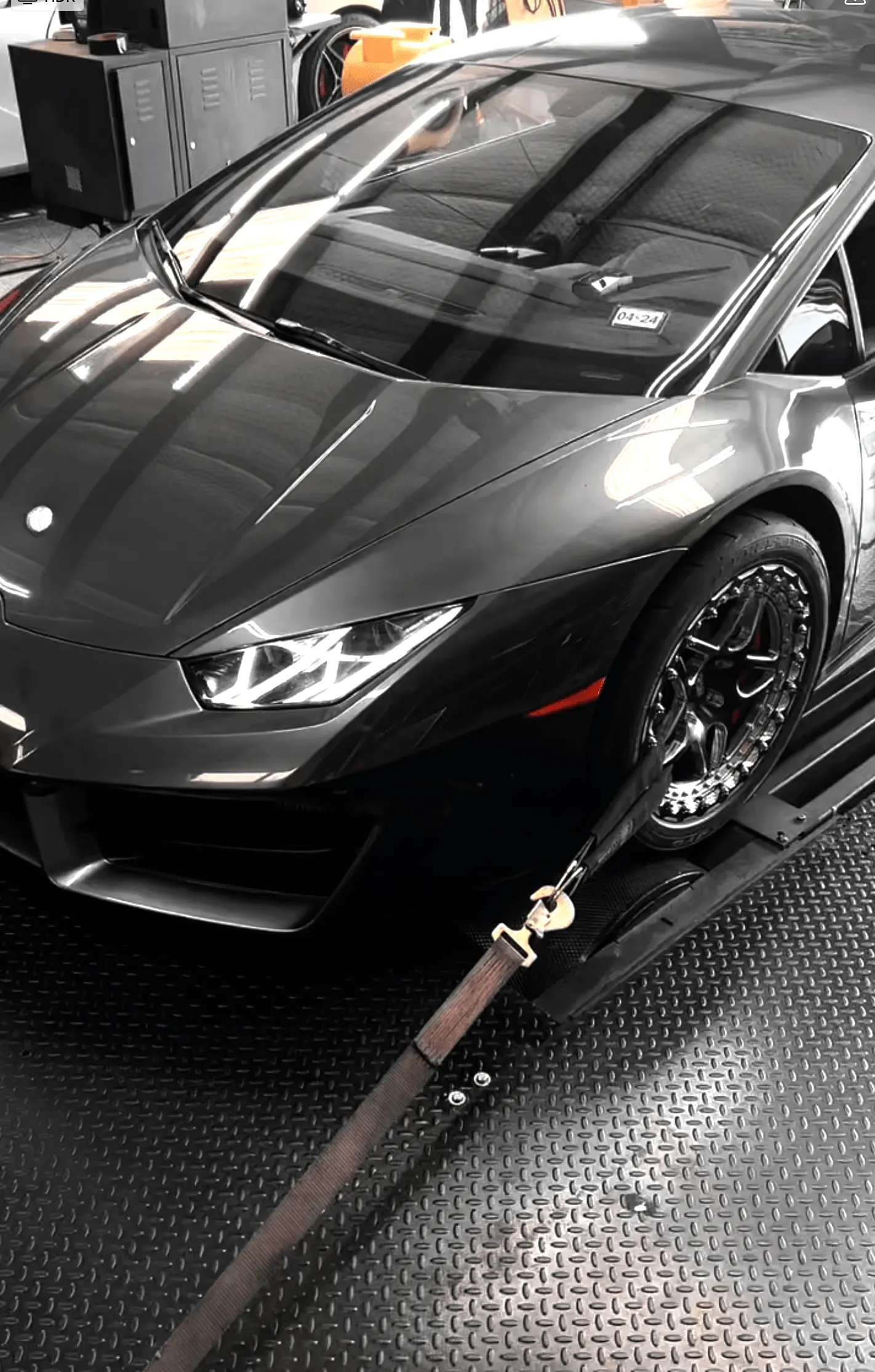 Grey Lamborghini Huracan strapped down on a dynamometer for performance tuning at Jotech Motorsports.