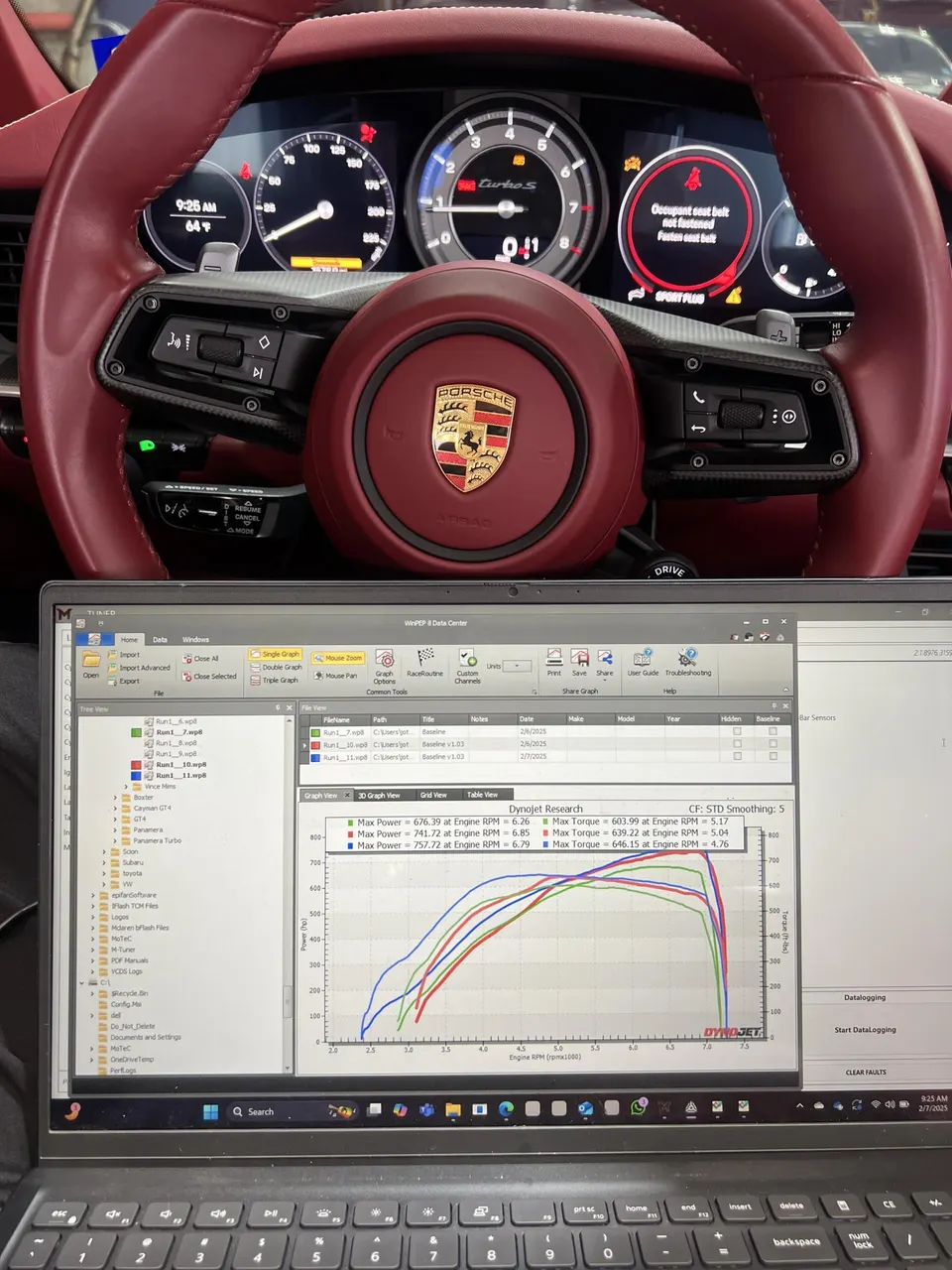 A Porsche Turbo S interior with a laptop displaying Dynojet research dyno results, showing power and torque curves.