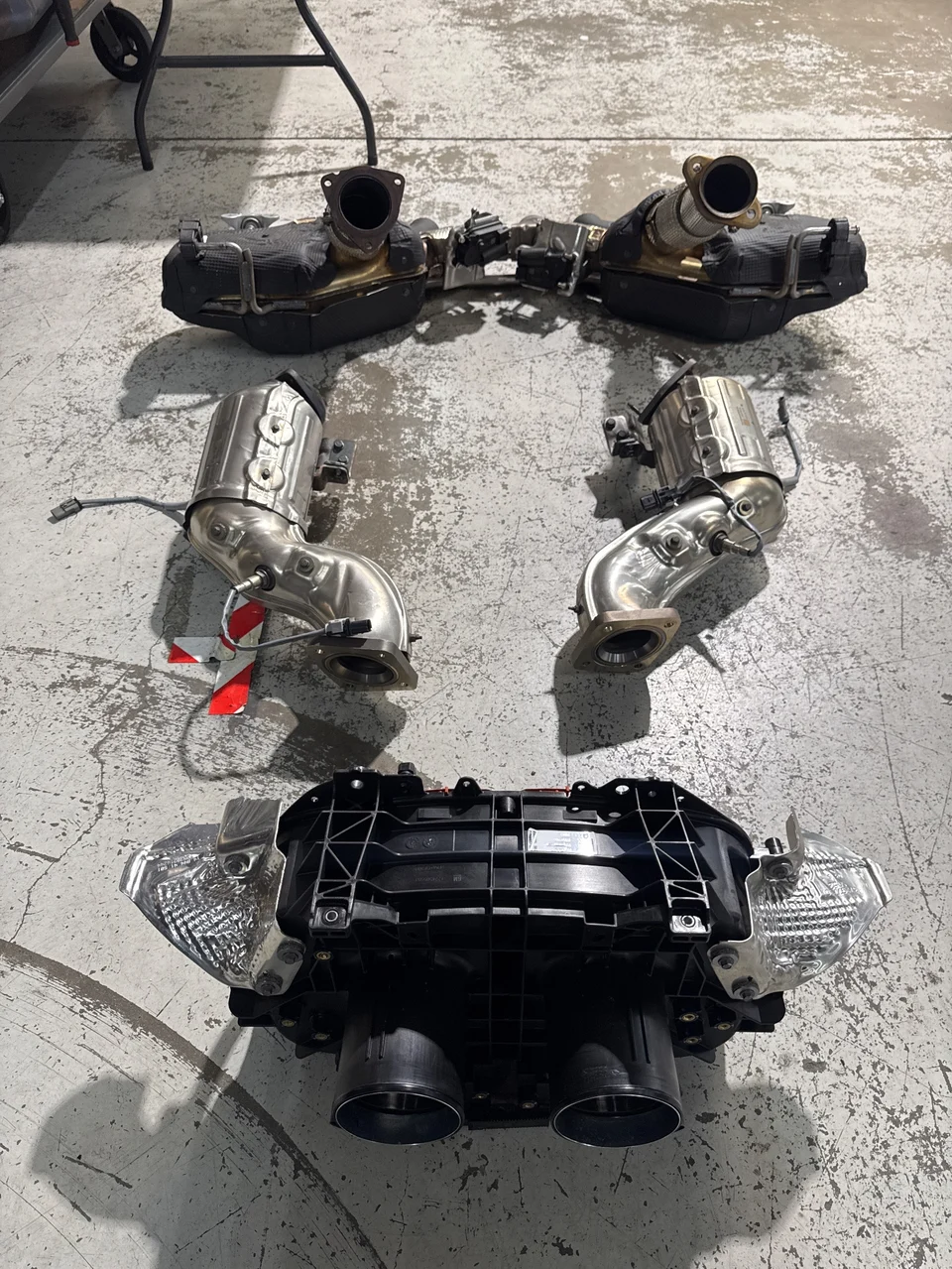 Your OEM exhaust system, including catalytic converters and muffler, is now off the car.