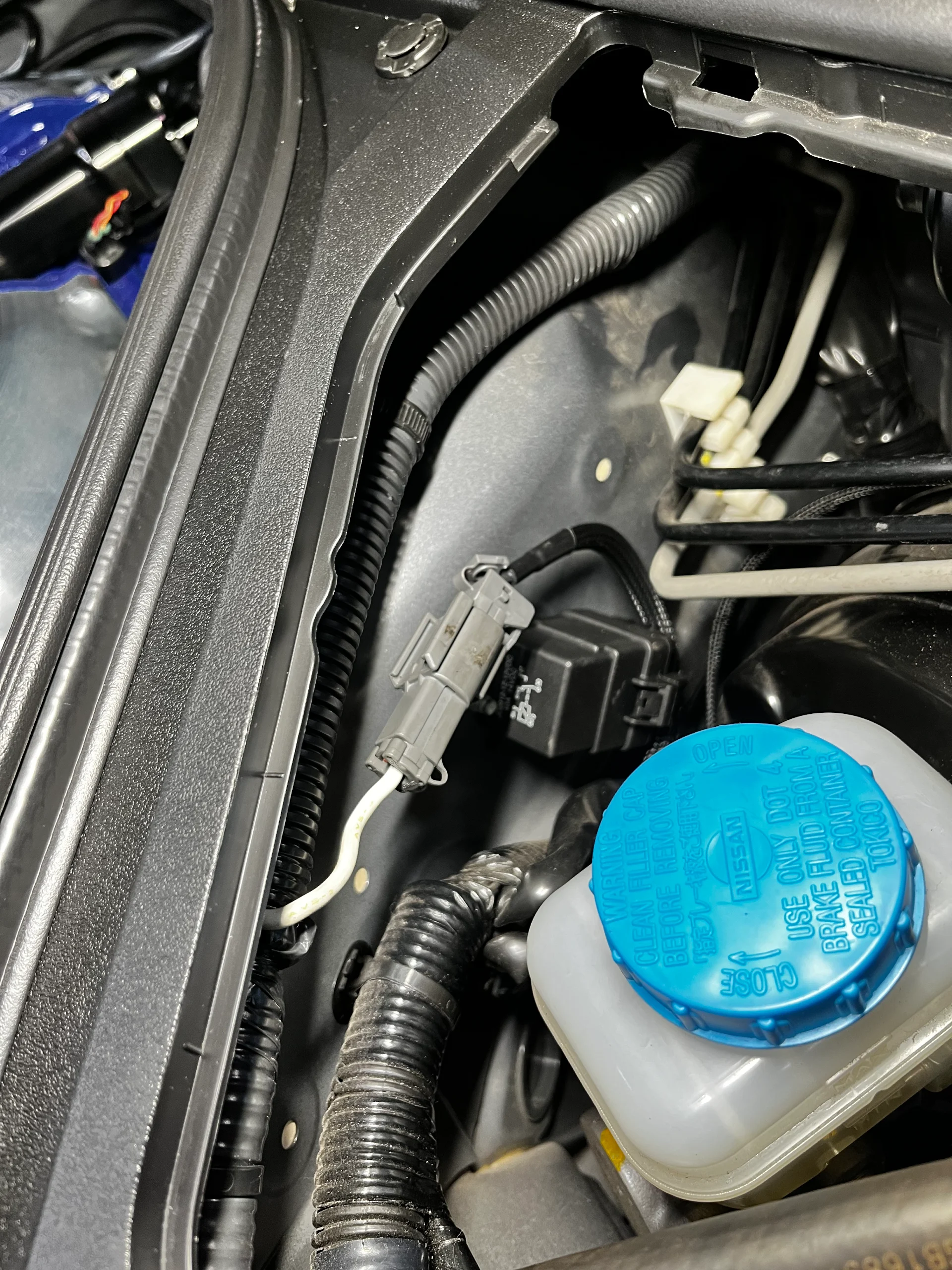 Your brake fluid reservoir is visible in the engine bay as we service your brake system.