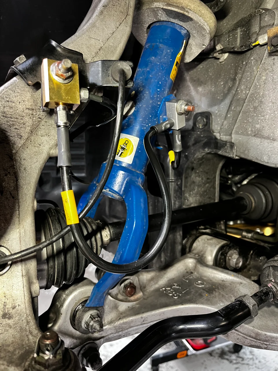 Your suspension system, including the shock absorber and control arms, is currently being inspected.