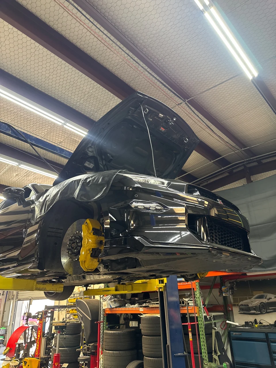 Your GT-R is on the lift, ready for inspection of the front passenger side brake noise.