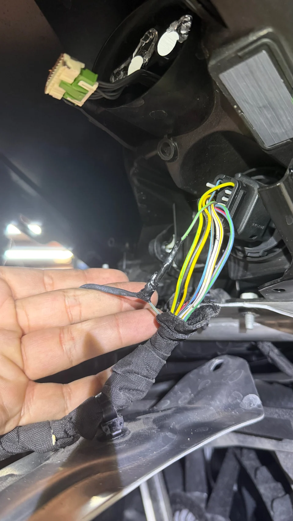 During further inspection of the left turn signal/headlight circuit, found previously modified wiring with a soldered connection in the harness. The soldered area appears to have been previously worked on and is not part of the factory wiring configuration.