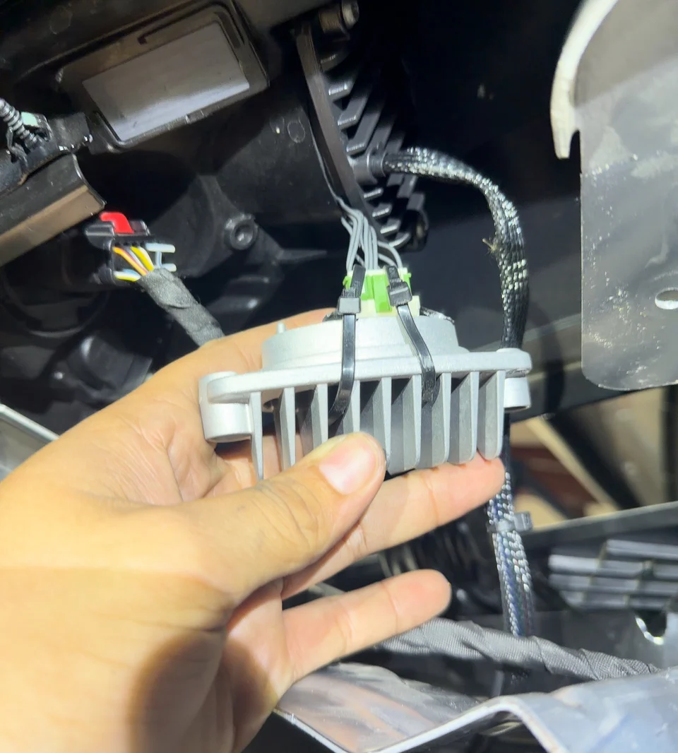 Your new electronic module with a heatsink is being wired in.