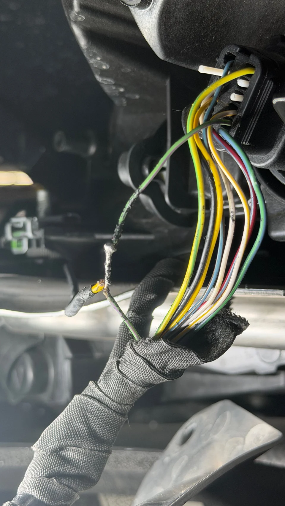 During further inspection of the left turn signal/headlight circuit, found previously modified wiring with a soldered connection in the harness. The soldered area appears to have been previously worked on and is not part of the factory wiring configuration.